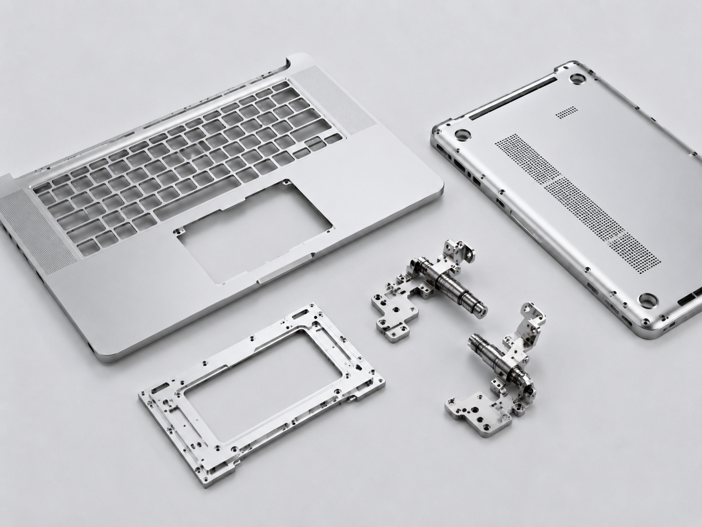 Precision laptop structural components including A-side and D-side housings, hinge joints, and touchpad brackets made with advanced amorphous alloy materials