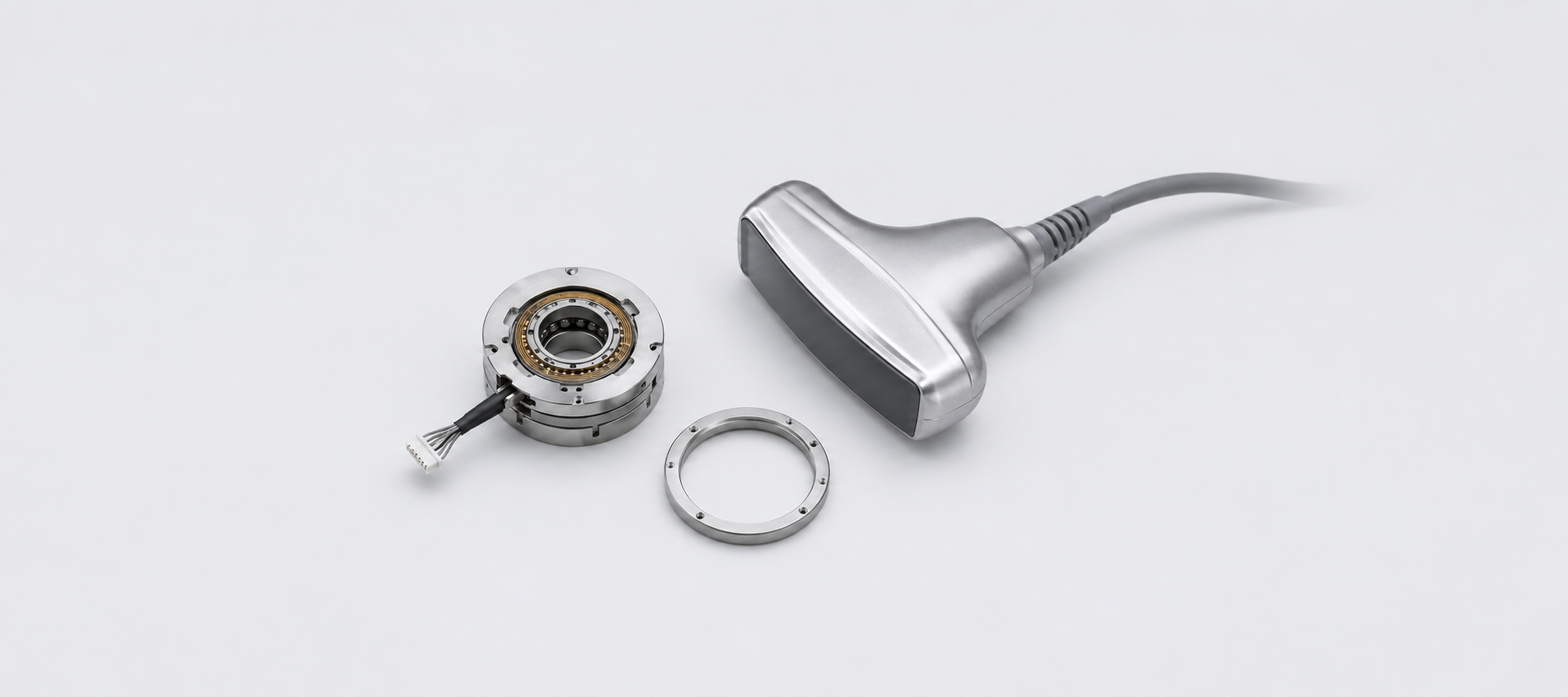 Amorphous alloy slip ring and precision housing components for a medical ultrasound probe
