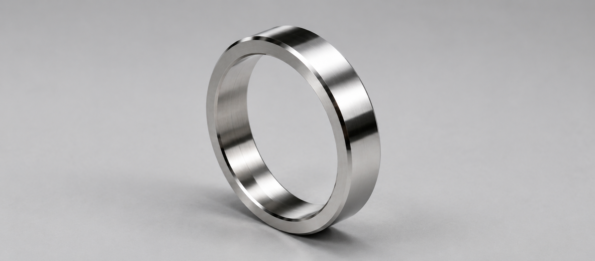 Amorphous alloy focusing rings, lens barrels and reference components for optical and measurement instruments