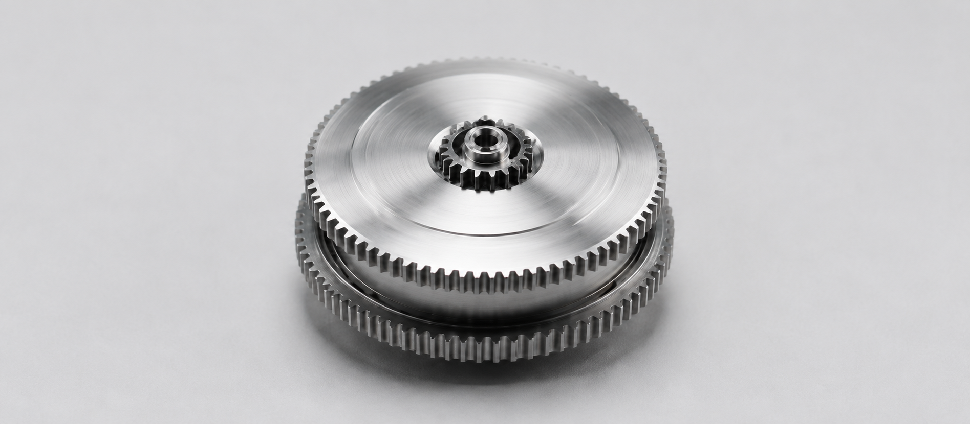 Amorphous alloy balance wheels and precision gear trains for instruments and watches
